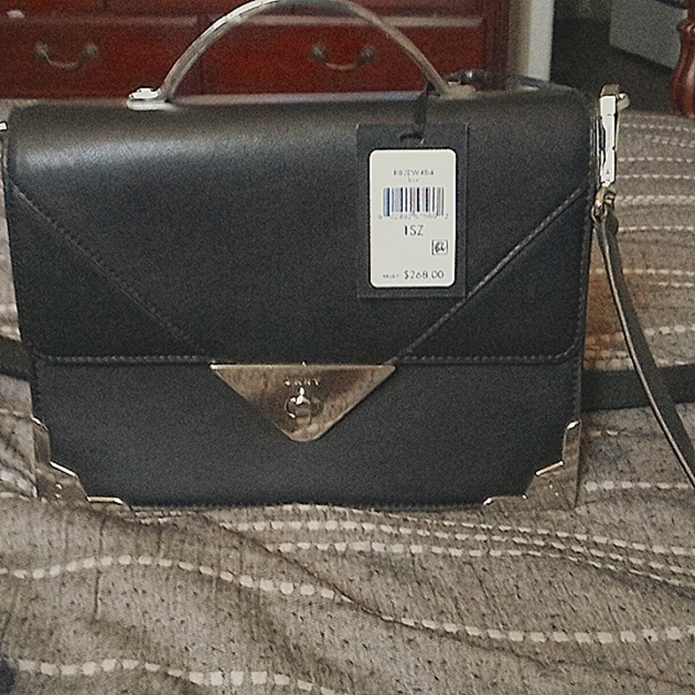 I'm selling a brand new black with silver DKNY purse